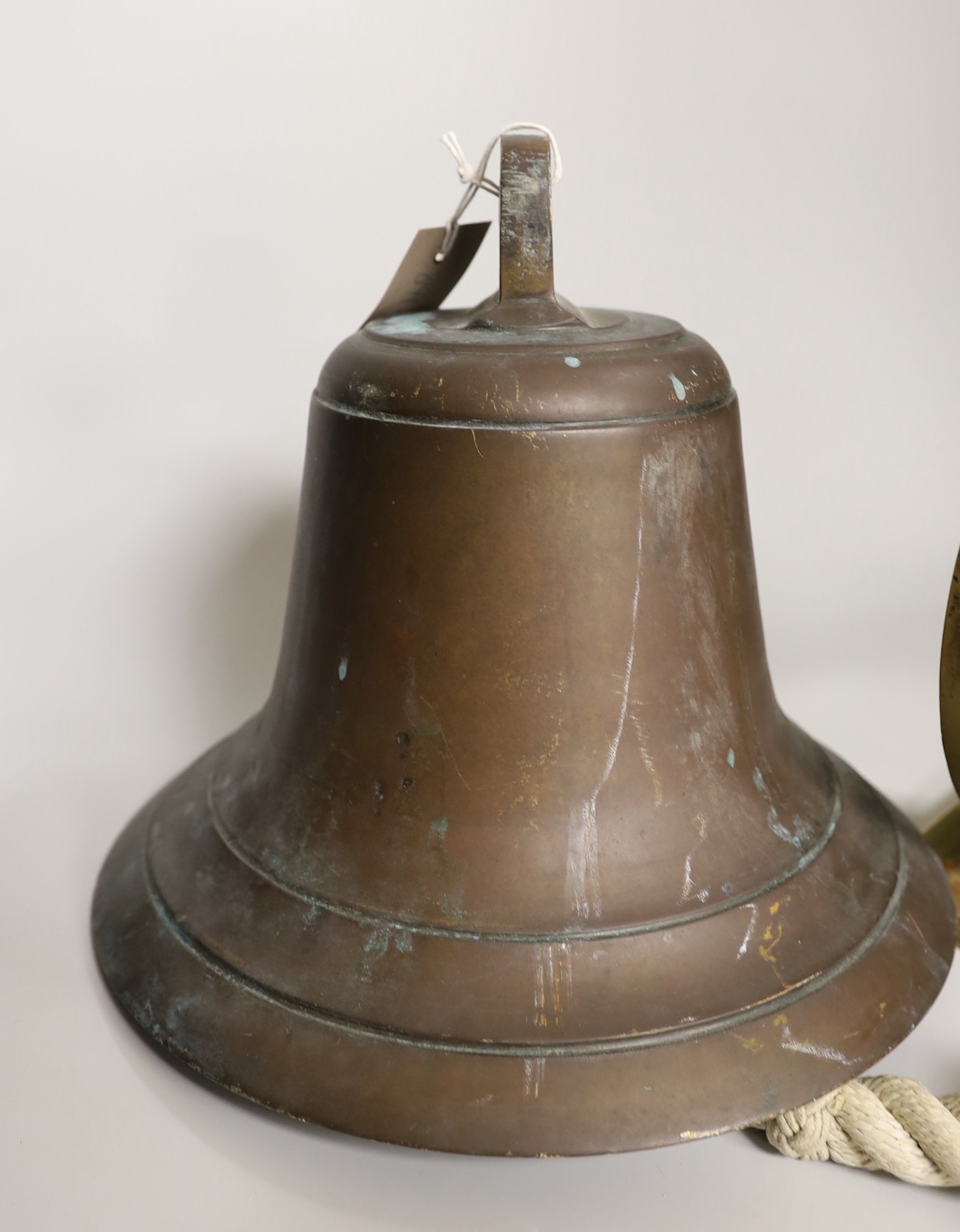 A ship's bell with brass bracket, salvaged from Chittagong ship yard between 1984-1989